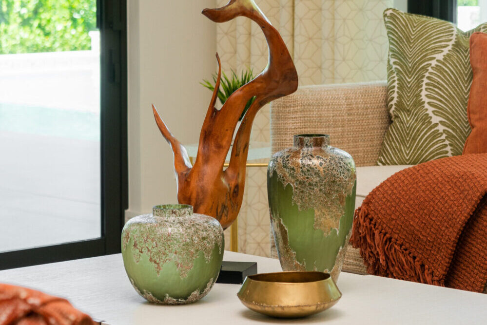 vases and sculptures on a table